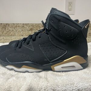 Jordan Black and Gold Sneakers